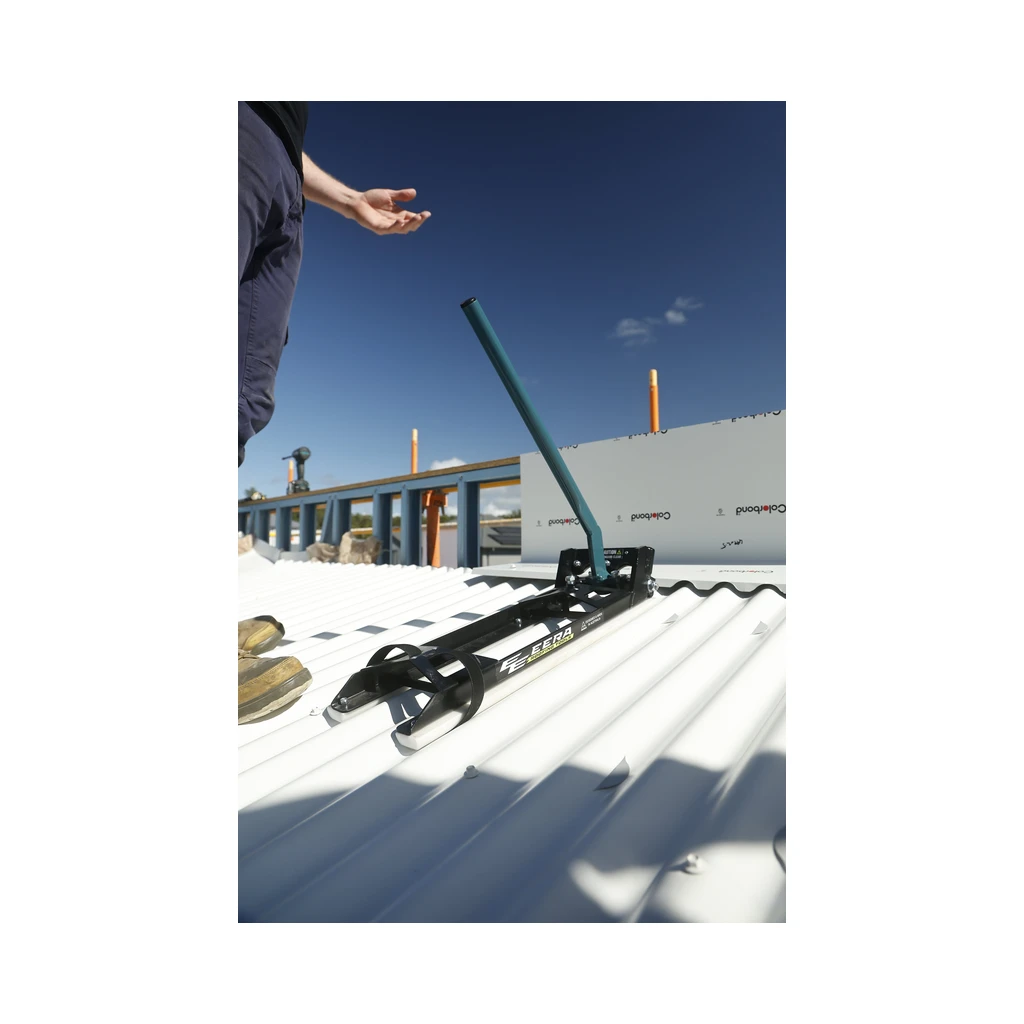 EERA corrugated notcher on a white corrugated roof under blue sky