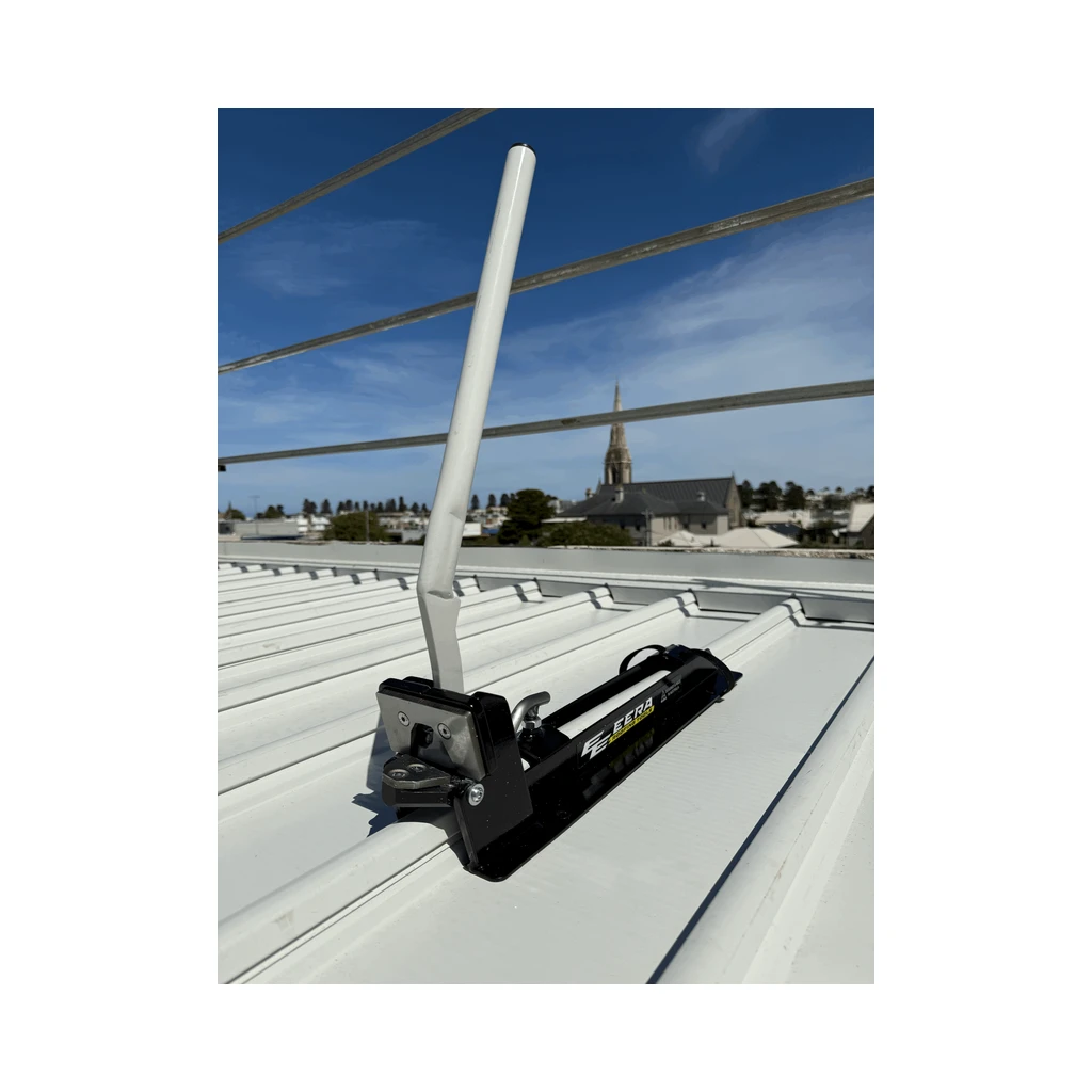EERA flashing notcher with white handle sitting on a Klip-Lok style roof rib