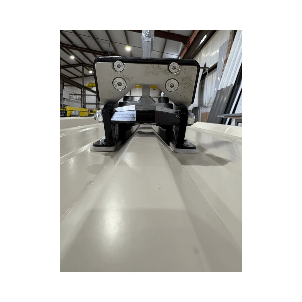 Front view of the EERA R Panel notcher straddling a panel rib inside a factory