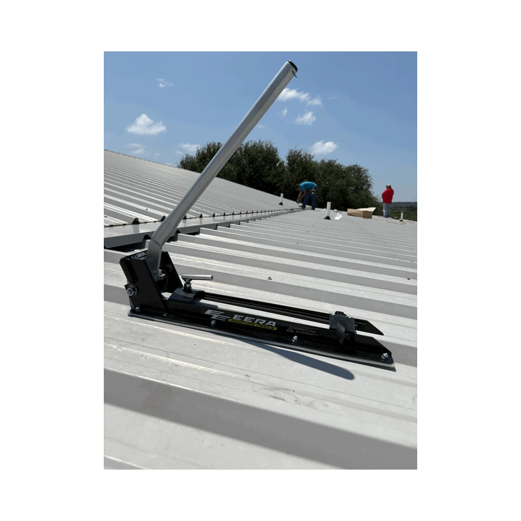 EERA R Panel notcher with silver handle on a wide pan ribbed roof